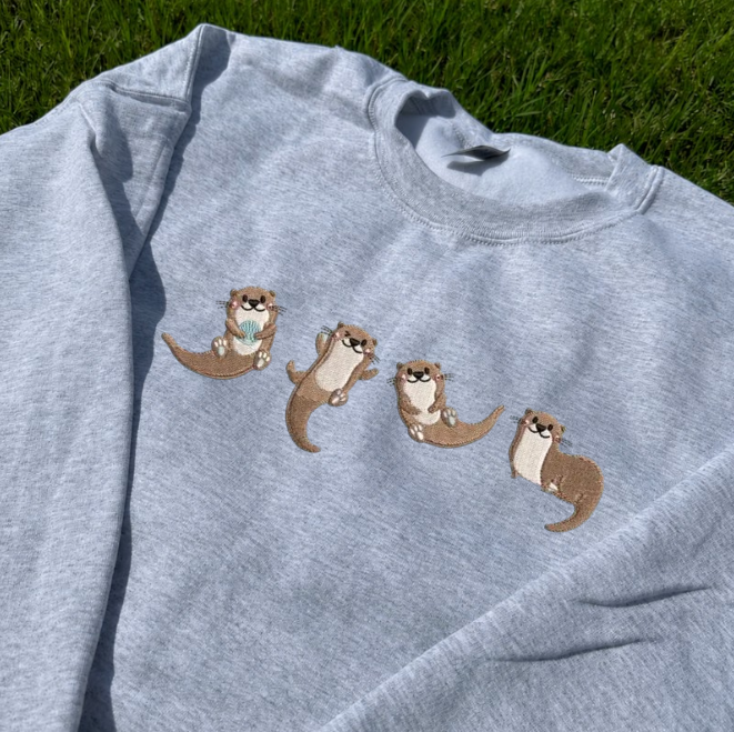 SEA OTTER HOLDING SHELL EMBROIDERED TEE BN-00041